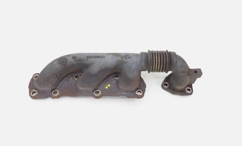 Metal exhaust manifold on a white background