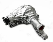 A silver aluminum automotive differential housing with a black splined input shaft and a red interior visible at the output flange, photographed on a white background.