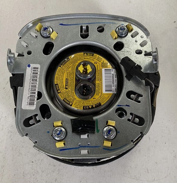Mechanical component with a yellow label on a white background