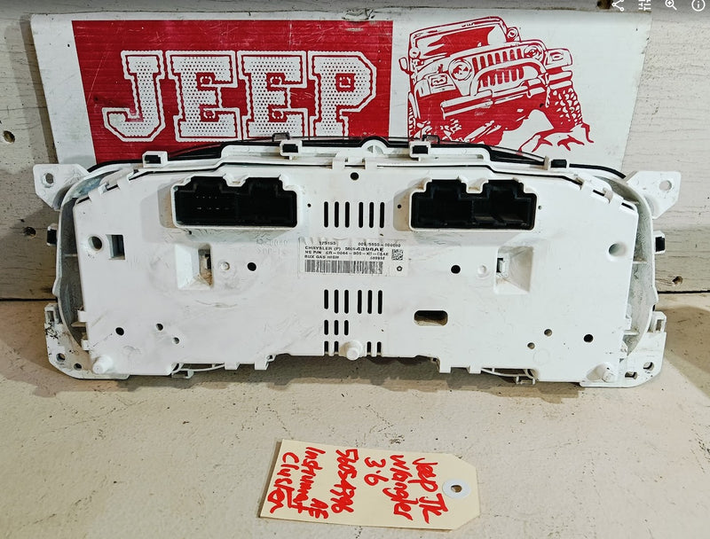 Car dashboard panel with Jeep logo in the background