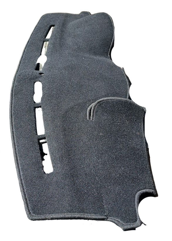 A dark gray carpeted automotive dashboard shield or trim panel with pre-cut openings, shown against a plain white background.