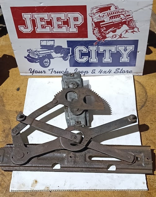 Vintage metal window regulator on a Jeep City sign in the background