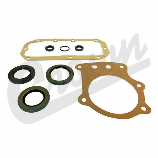 A set of gaskets and seals for a Jeep Transfer Case, including various shaped gaskets and a rod seal, with a gold and silver color. Dana 300 Transfer Case Kit