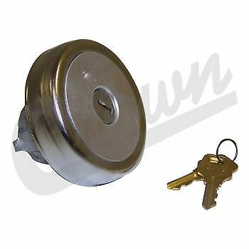 A silver-colored Jeep fuel filler cap with a lock mechanism and a set of keys.